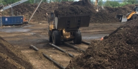 loader scooping compost
