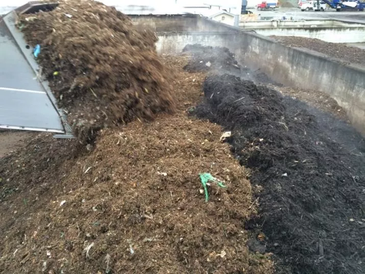 Aerated Static Compost Pile Being Covered with Finished Compost for VOC and Odor Control