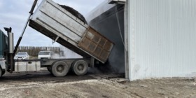 truck dumping organics in to compost zone