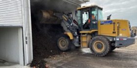 loader dumping organics in to compost zone