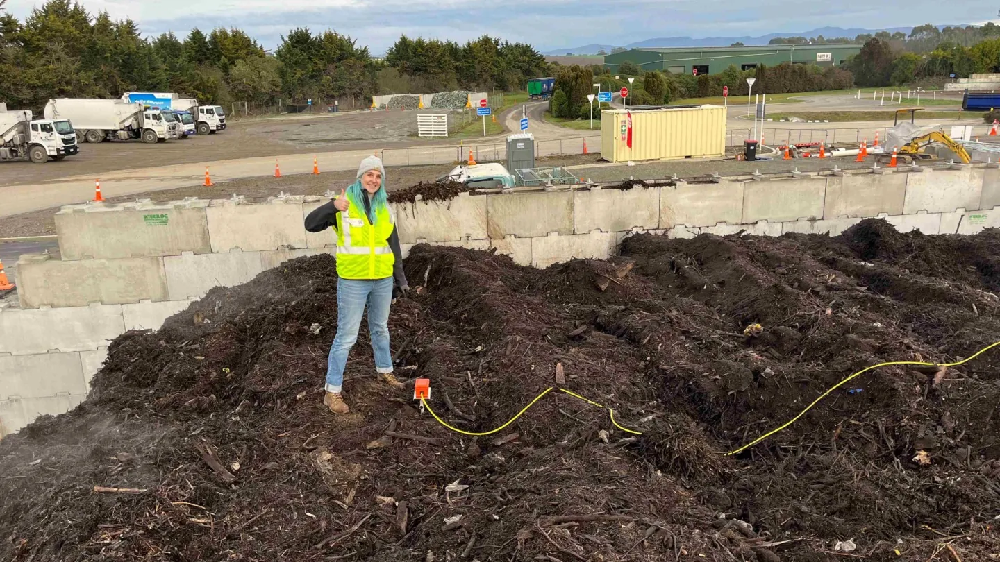 engineer inspecting compost pile